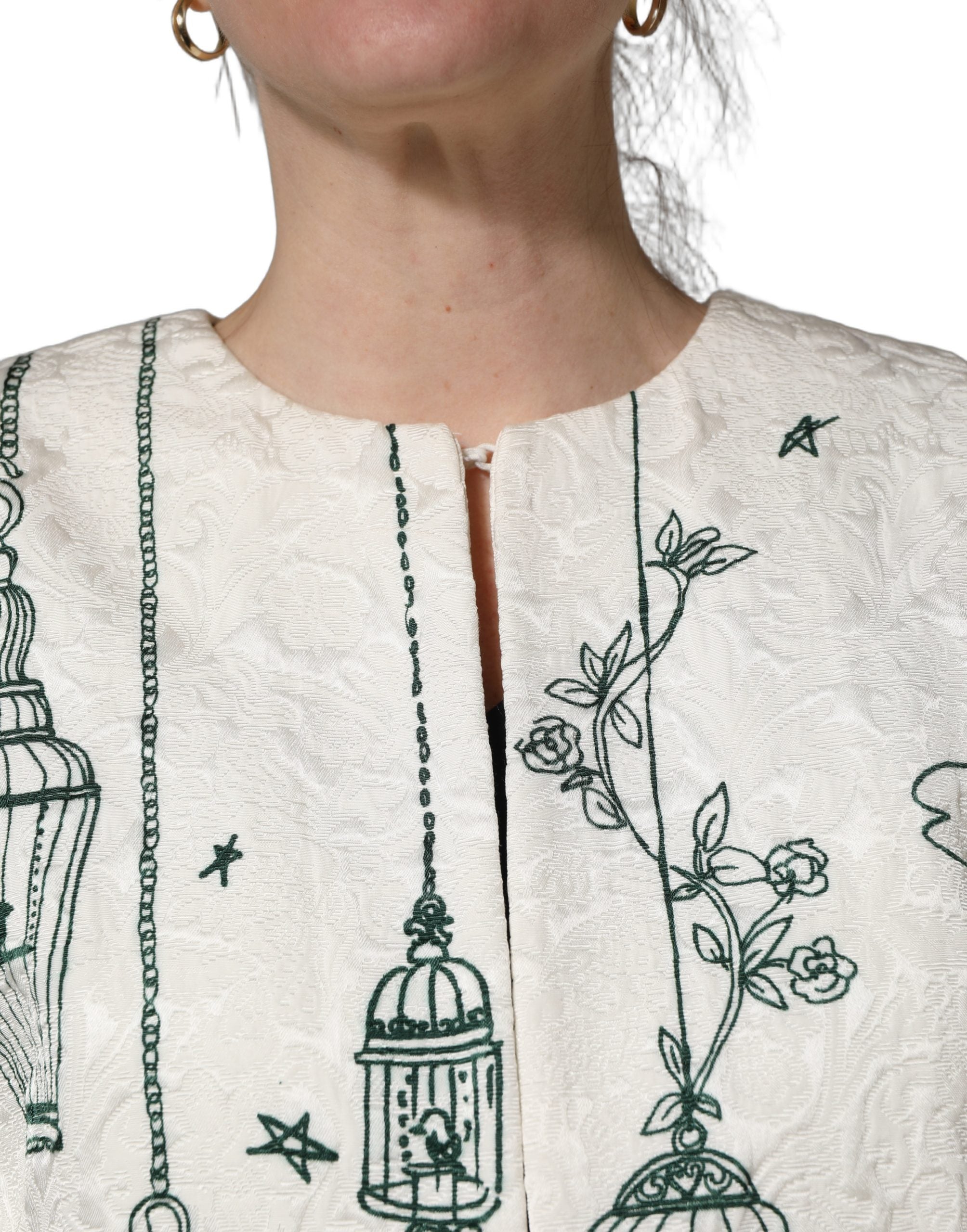 Veste Dolce & Gabbana en jacquard blanc avec motif jardin, coupe élégante et détails sophistiqués.