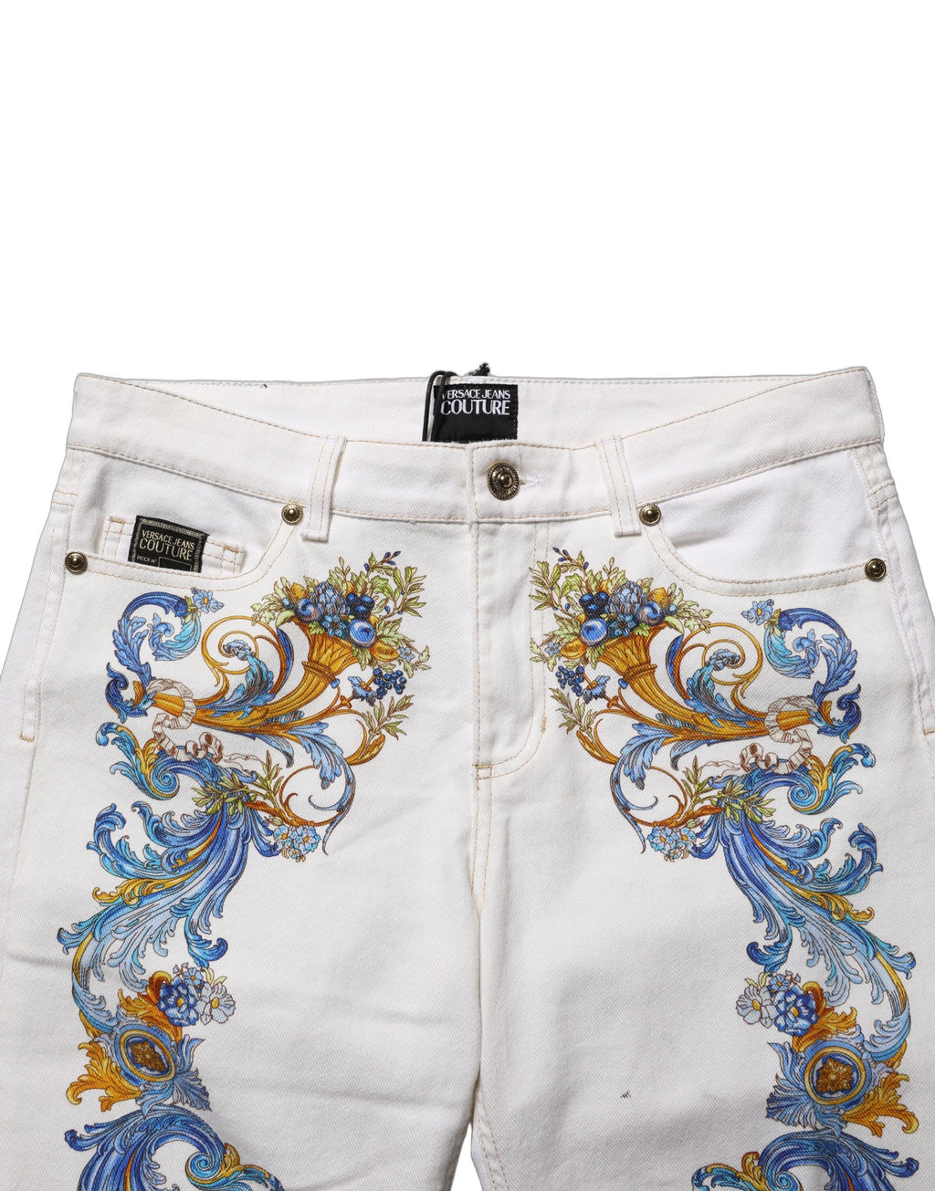 Jeans skinny blancs de Versace Jeans Couture avec motif floral imprimé, en denim ajusté et tendance.