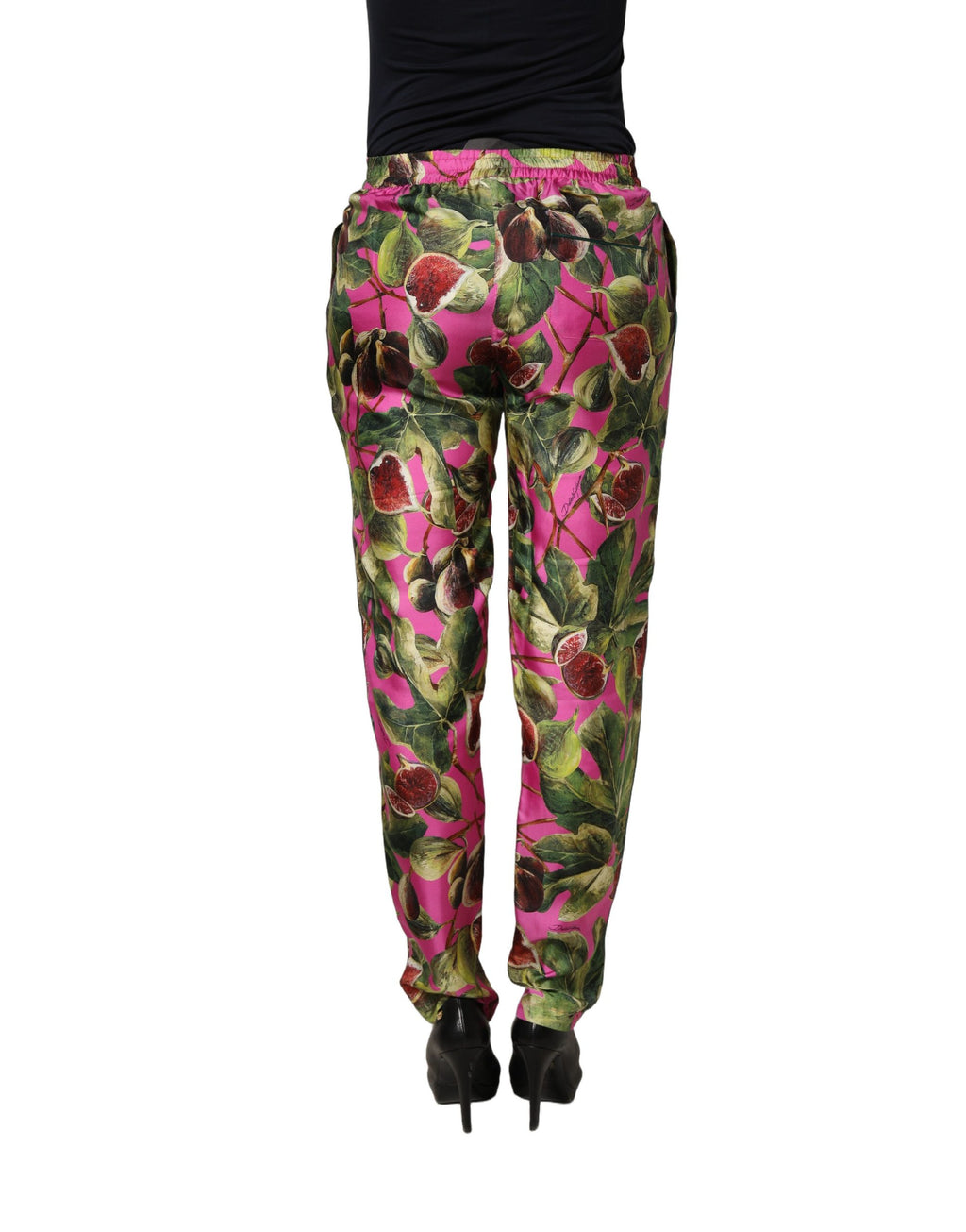 Pantalon Dolce & Gabbana Fuchsia Fig avec motif de feuilles, coupe évasée et style élégant, porté sur un mannequin.