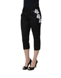 Pantalon court noir Dolce & Gabbana avec appliqué en dentelle et rayures, style élégant et sophistiqué.