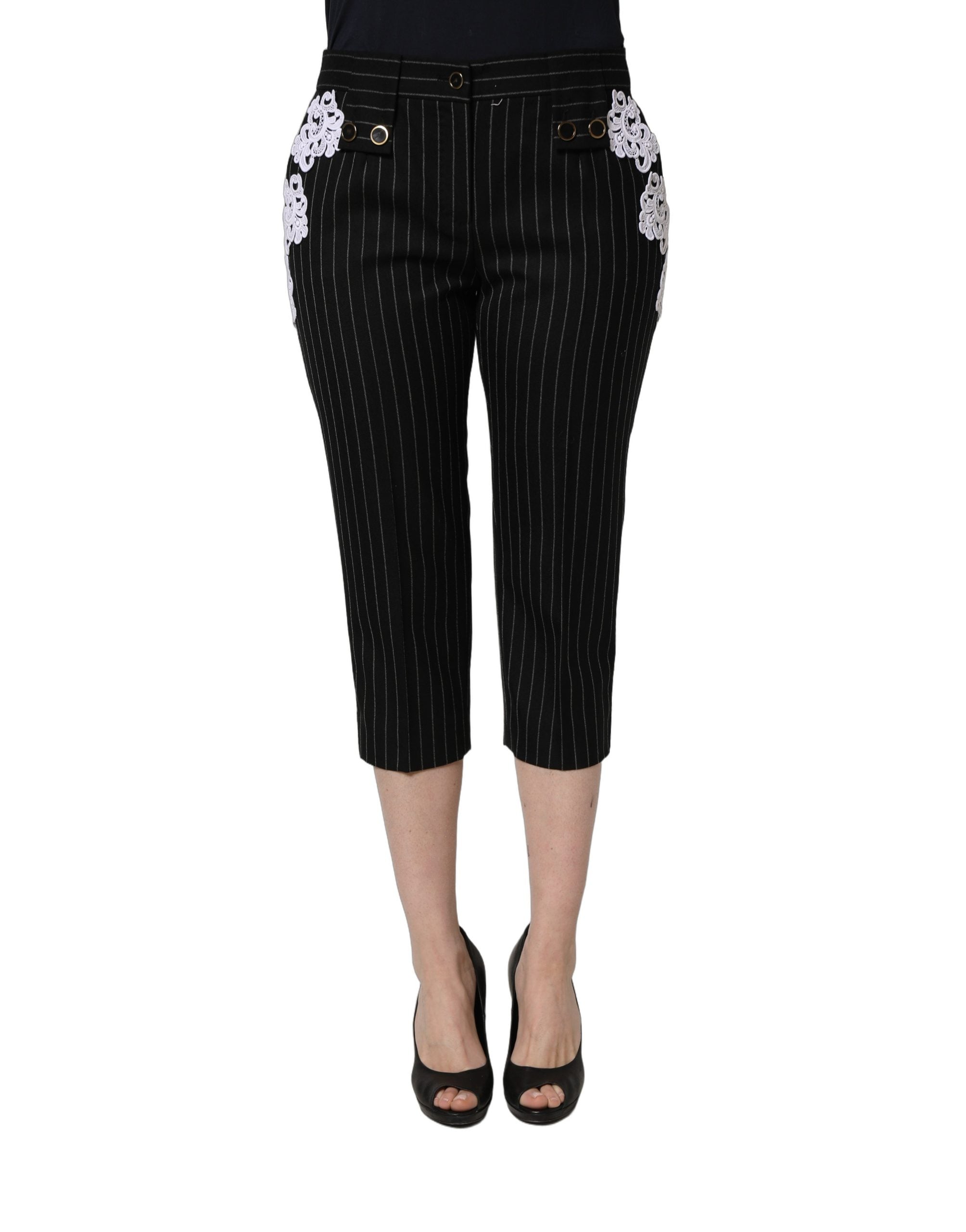 Pantalons cropped noirs Dolce & Gabbana avec appliqué en dentelle et rayures, détails élégants et sophistiqués.