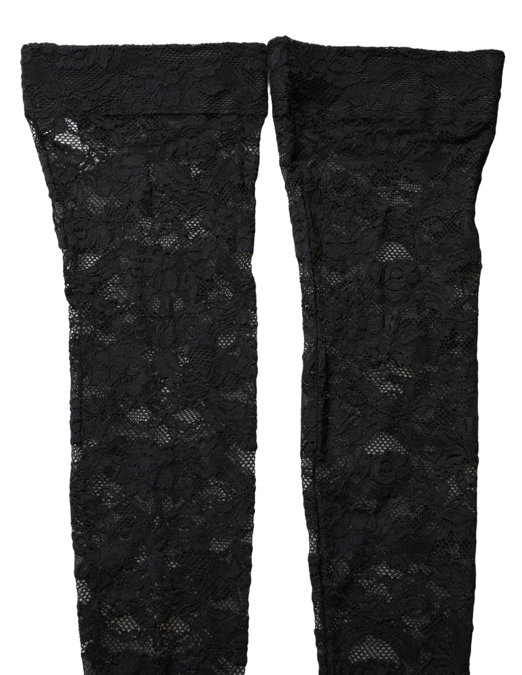 Chaussettes hautes en dentelle florale noire de Dolce & Gabbana, élégantes et sophistiquées, visibles sur la jambe.