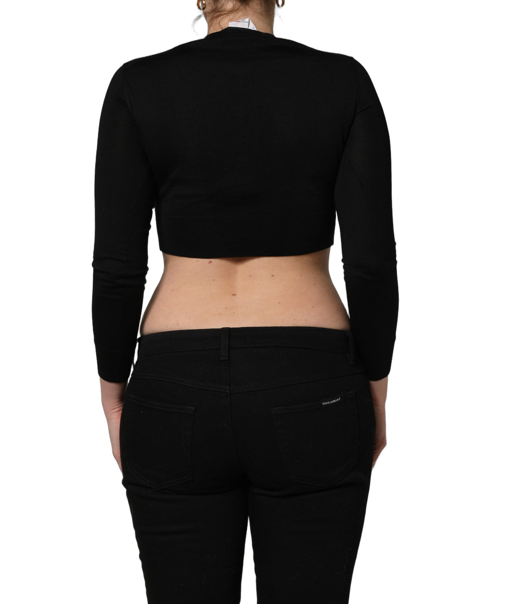 Top noir à manches longues Dolce & Gabbana avec imprimé graphique noir et blanc, style élégant et moderne.