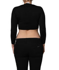 Top noir à manches longues Dolce & Gabbana avec imprimé graphique noir et blanc, style élégant et moderne.