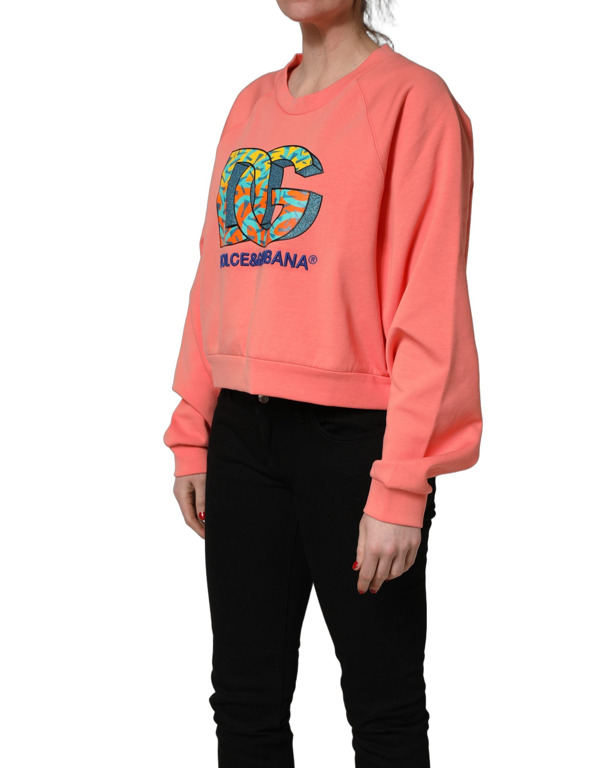Sweat-shirt cropped rose Dolce & Gabbana à col rond graphique, doux et tendance, idéal pour un style décontracté.