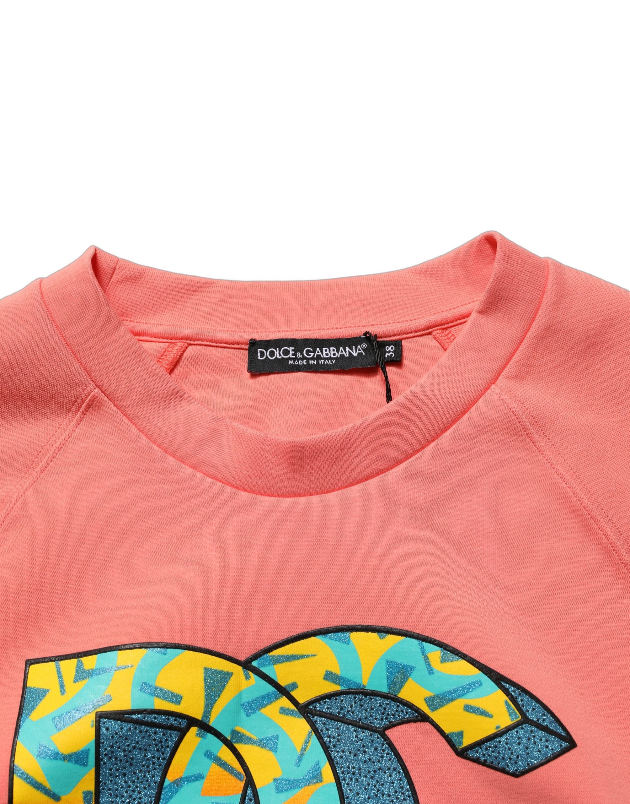Sweat-shirt cropped rose à graphique Dolce & Gabbana avec col rond, en coton, vue de face.
