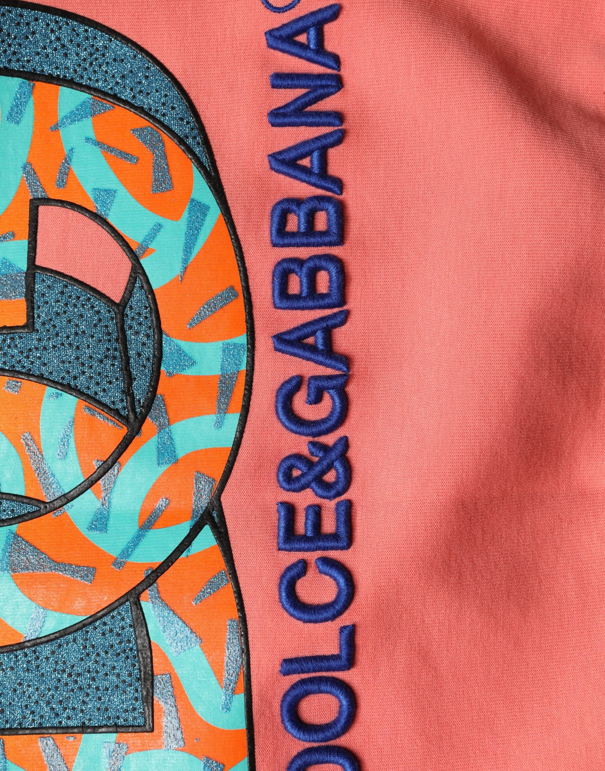 Sweatshirt court Dolce & Gabbana rose avec motif graphique, col rond et coupe cropped, en coton rose vif.
