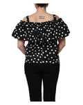 Haut noir et blanc à pois Dolce & Gabbana, décolleté en off-shoulder avec manches longues, élégance sophistiquée.