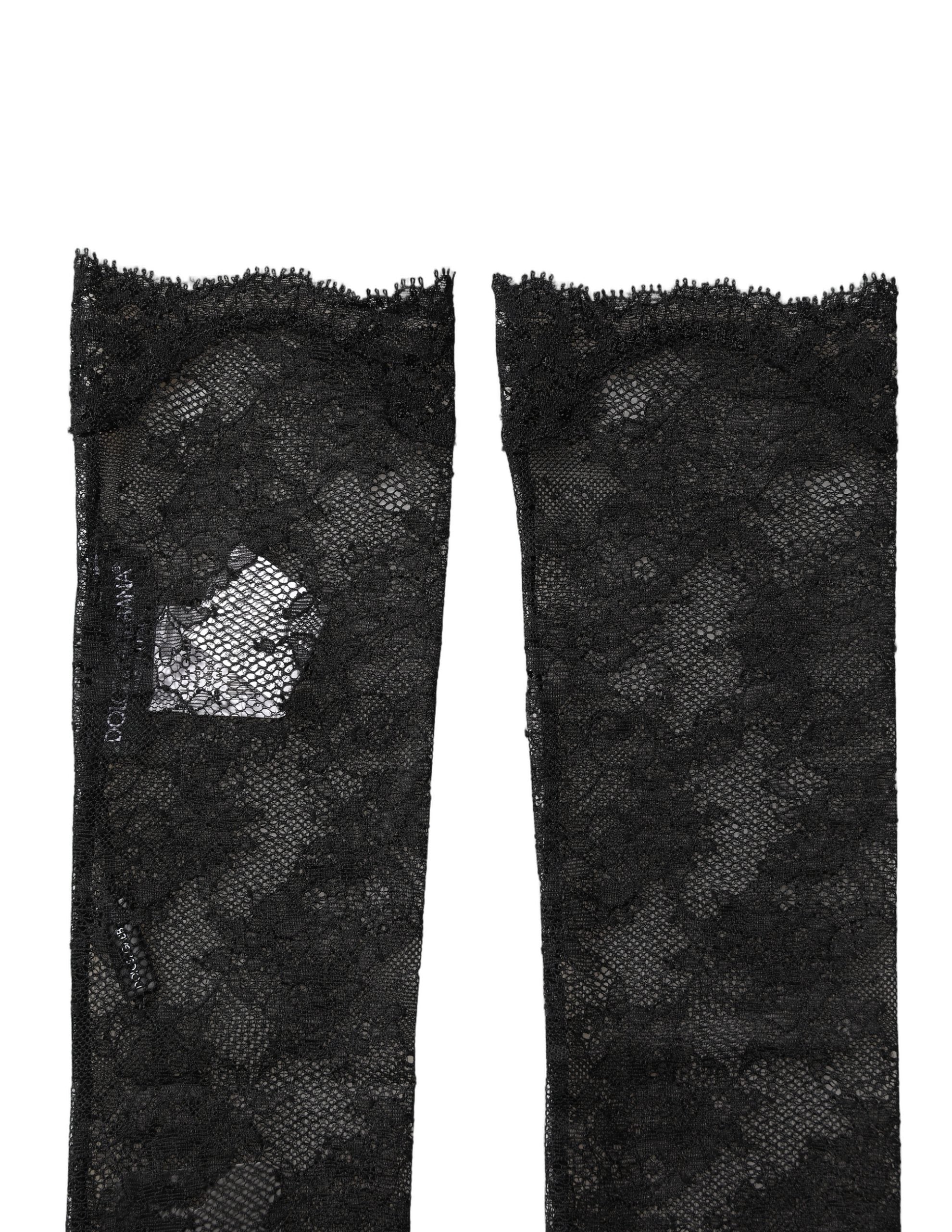 Chaussettes hautes en nylon stretch noire à fleurs en dentelle, par Dolce & Gabbana, avec motifs floraux élégants.