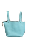 Sac Hermès Picotin Lock 18 en cuir avec poignée torsadée et fermoir métallique, couleur beige clair.