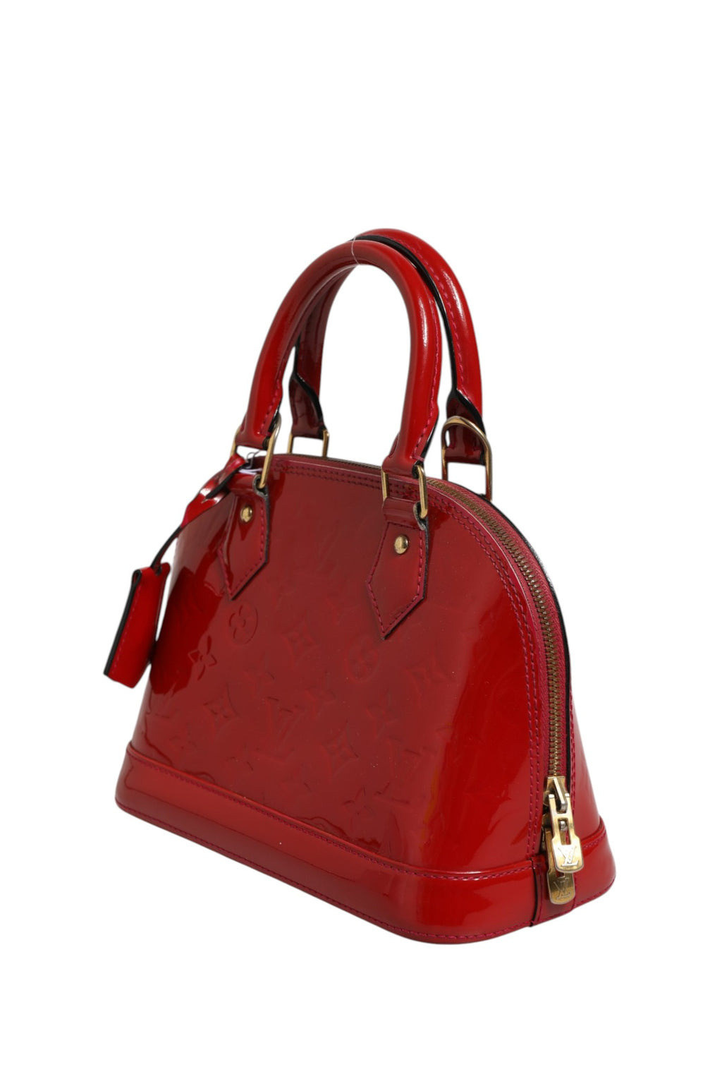 Sac Louis Vuitton Alma BB en vernis Monogram Pomme D'Amour avec poignées en cuir et fermeture métallique élégante.