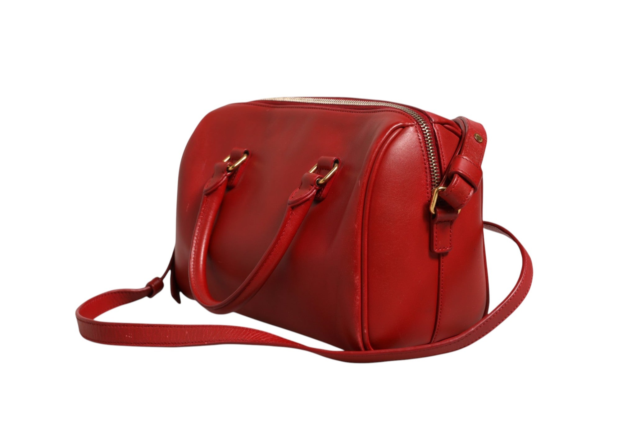 Sac à bébé classique Saint Laurent Duffle avec poignées en cuir et logo emblématique, en cuir noir élégamment structuré.