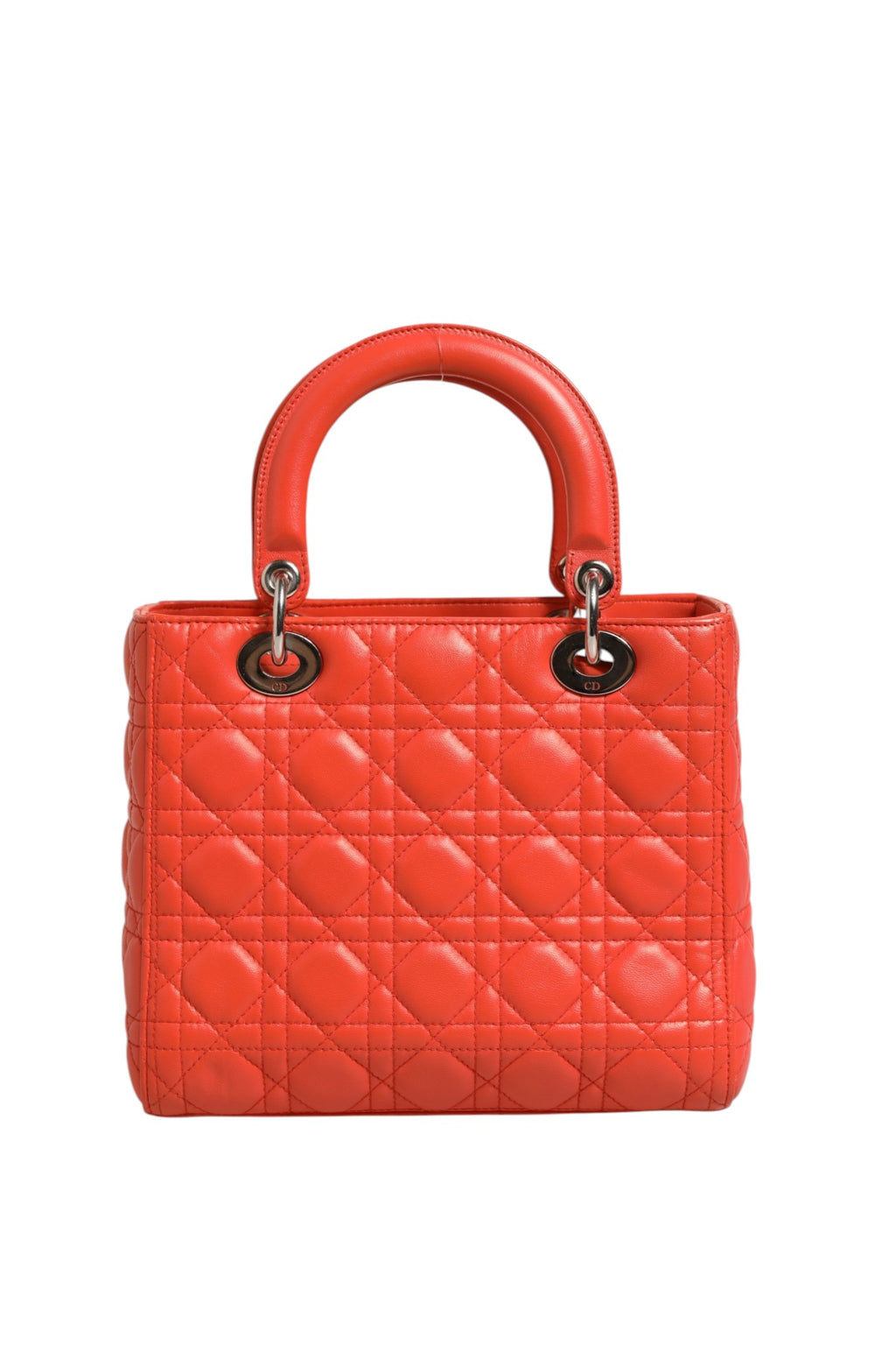 Sac à main Lady Dior en cuir d'agneau orange avec motif Cannage, finition élégante de la marque Christian Dior.