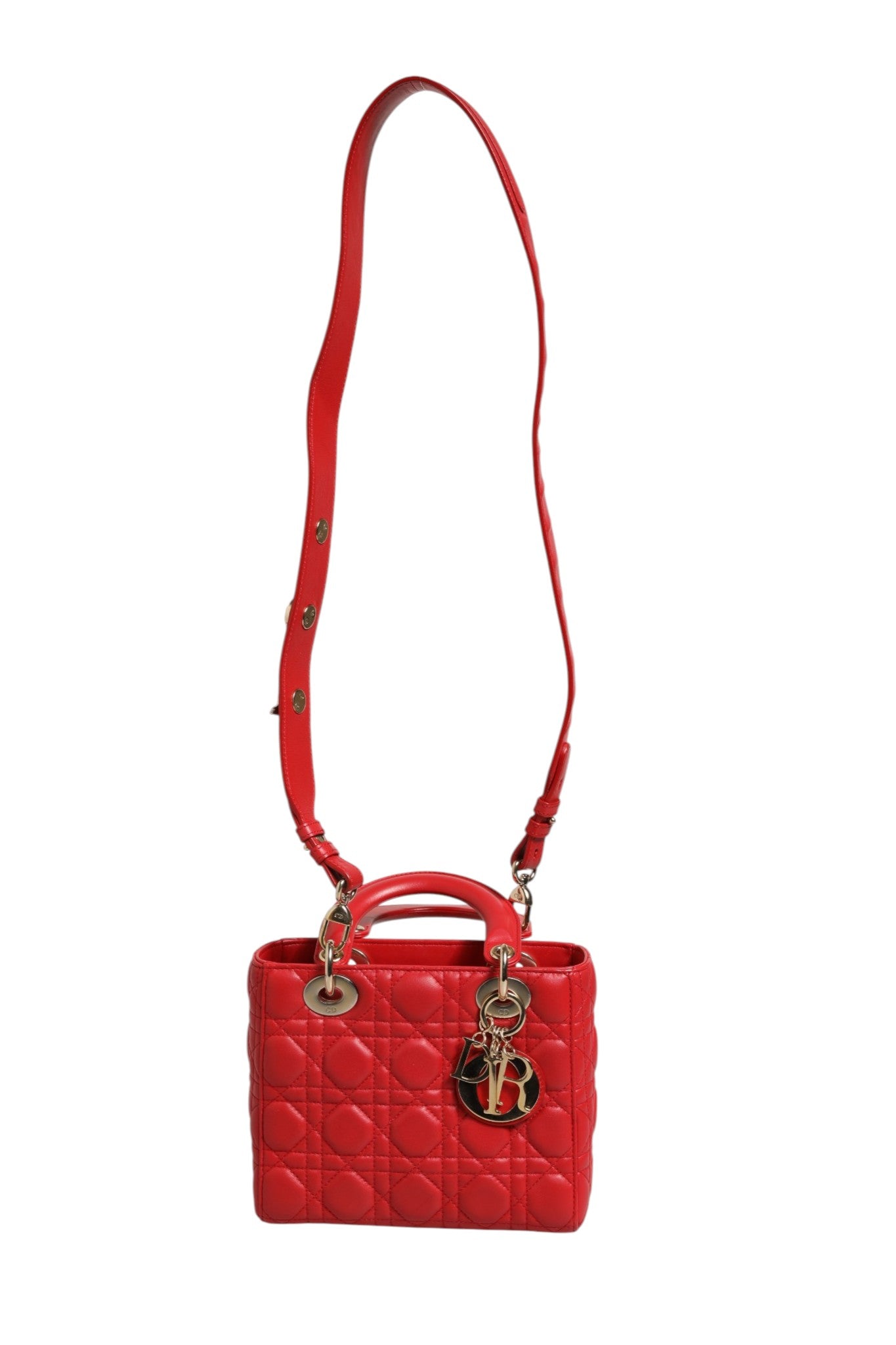 Sac à main en cuir Lady Dior Cannage de Christian Dior, motif cannage élégant et poignée en cuir beige.