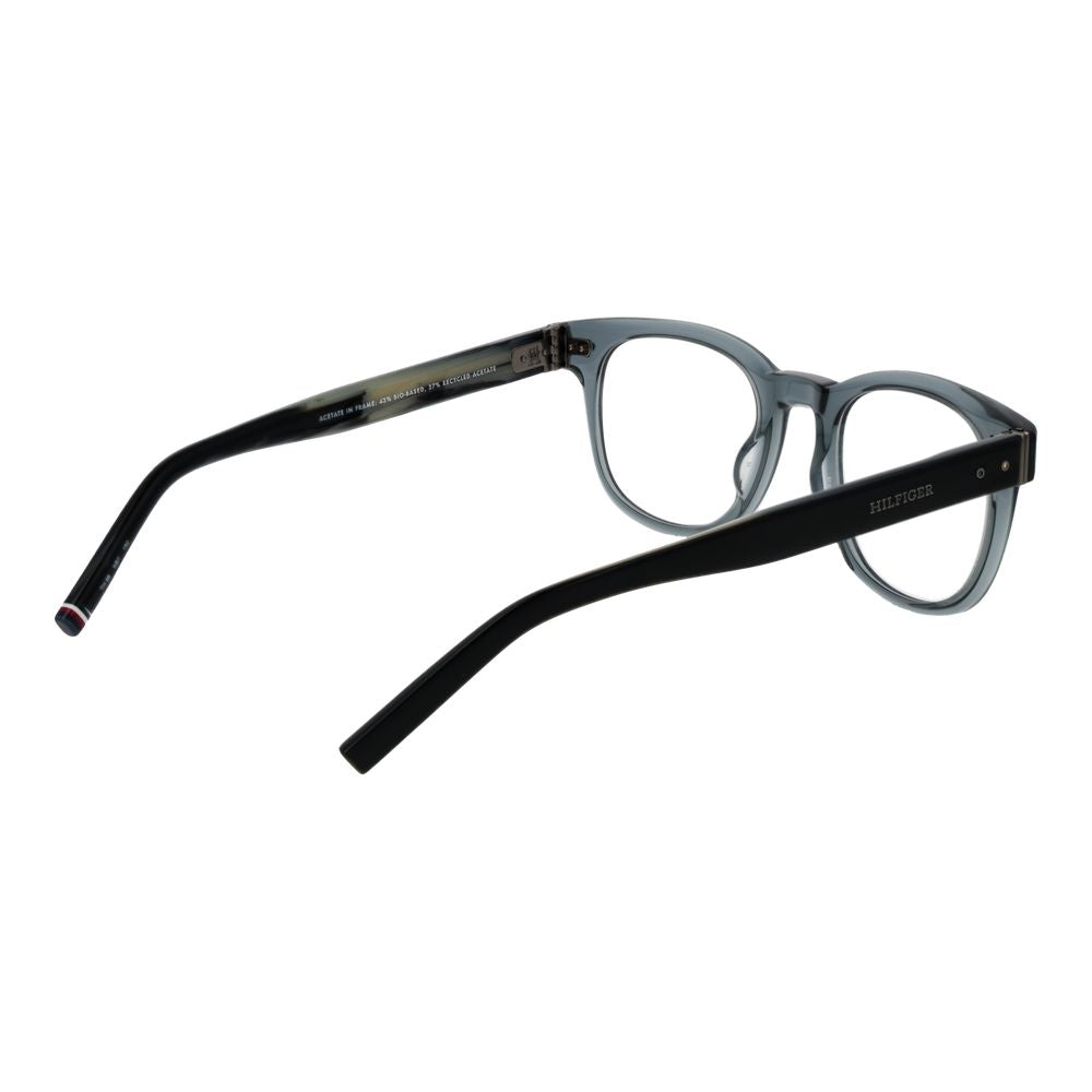 Lunettes en acétate grises Tommy Hilfiger avec monture élégante, visibles en gros plan sur fond neutre.