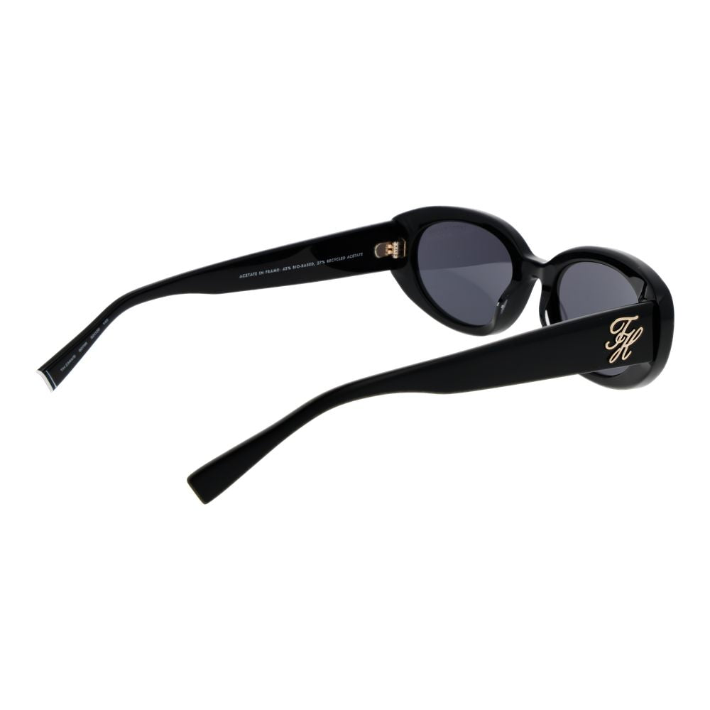 Lunettes de soleil noires en acétate Tommy Hilfiger avec monture rectangulaire et logo sur les branches.
