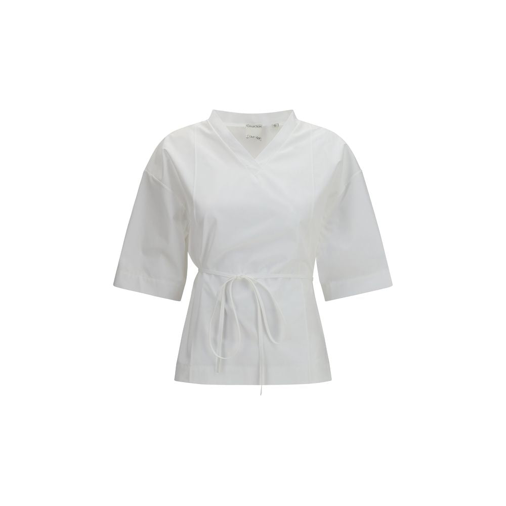 Chemise blanche à manches courtes Calvin Klein en coton, vue de face avec col classique et boutonnière visible.