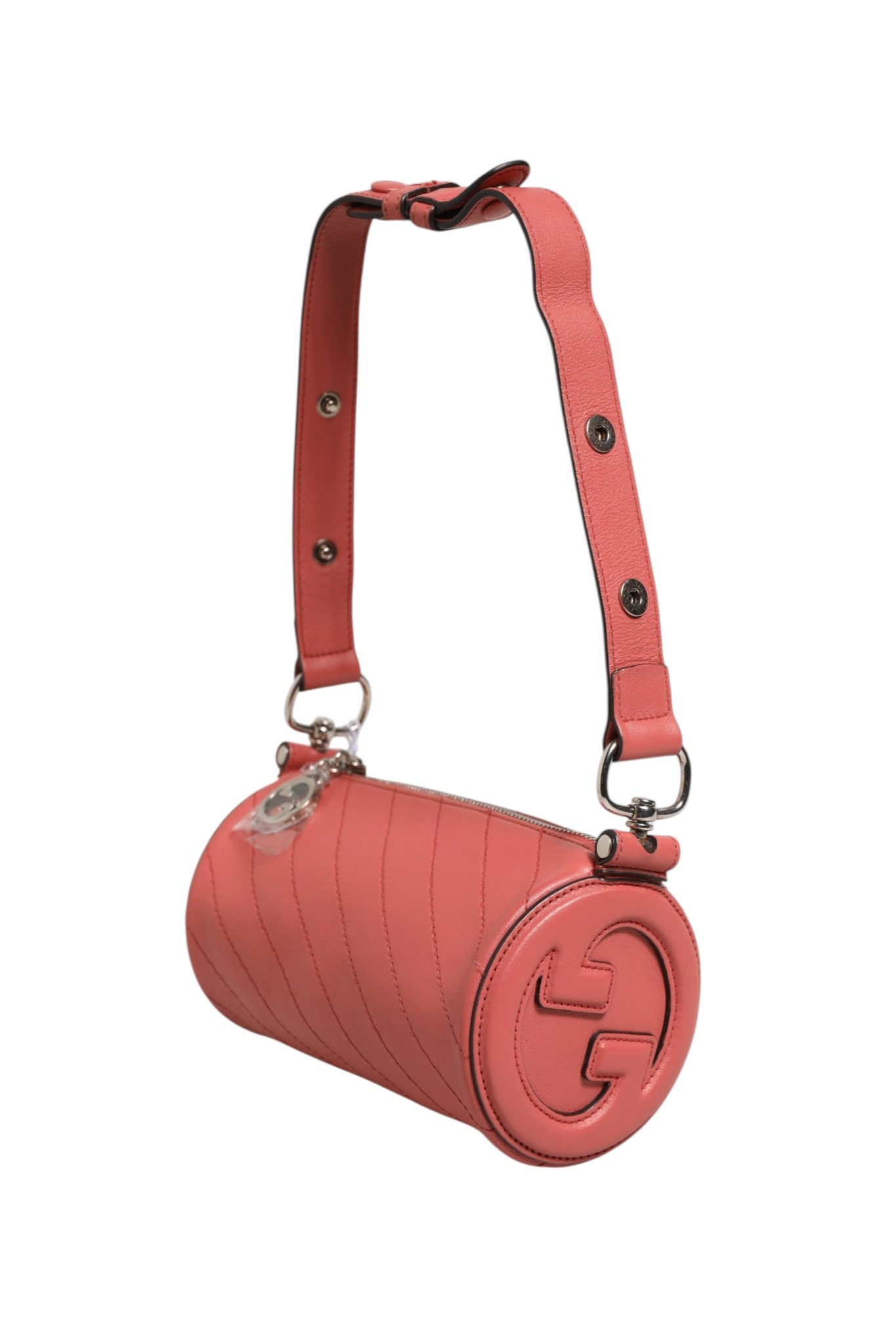 Sac bandoulière Gucci Blondie Mini en cuir rose, élégant et compact, avec détails de la marque et finition soignée.