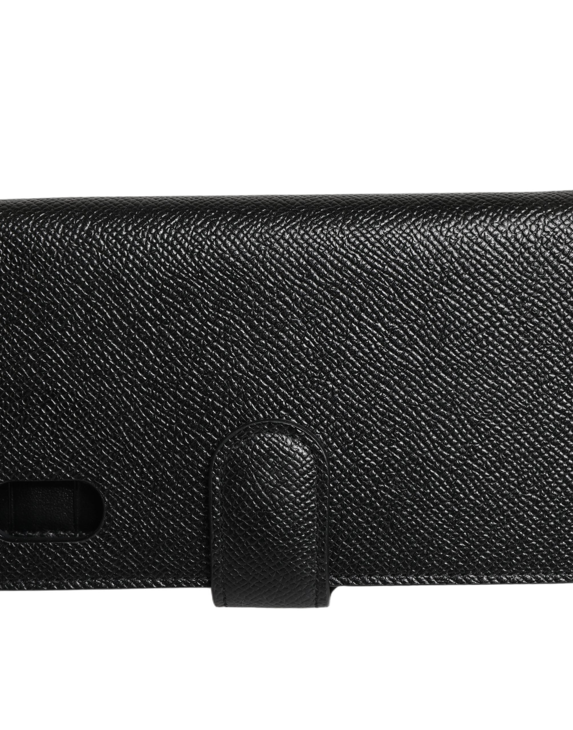 Étui à rabat Dolce & Gabbana en cuir de veau noir pour iPhone X et XS, avec finition élégante et design sophistiqué.