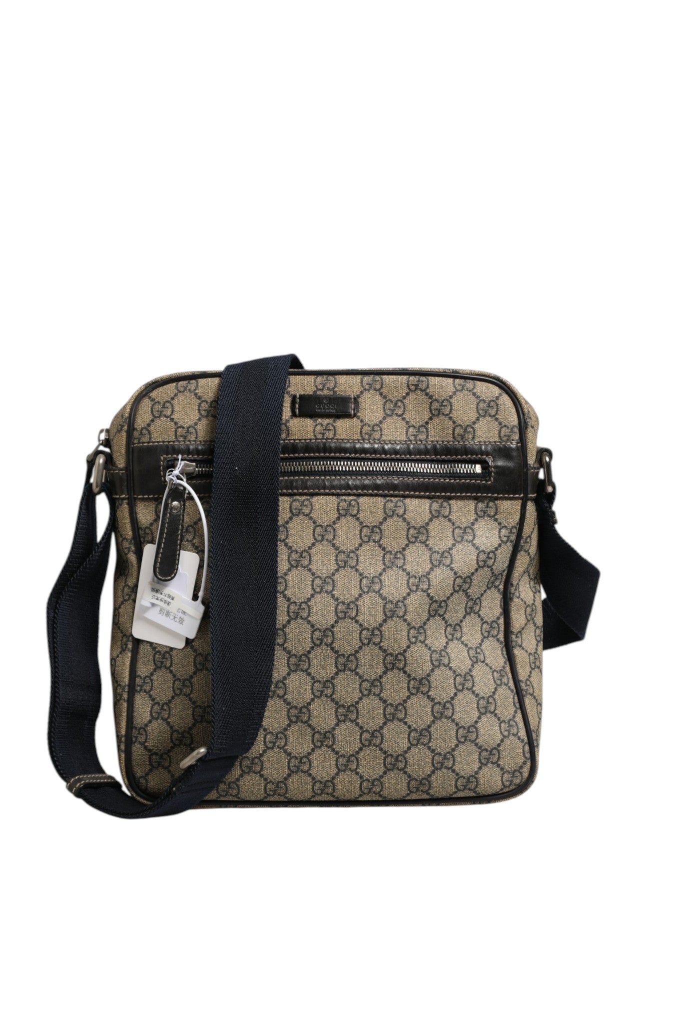 Sac messenger Gucci Supreme en toile avec détails en cuir et logo Gucci, idéal pour un style élégant et pratique.