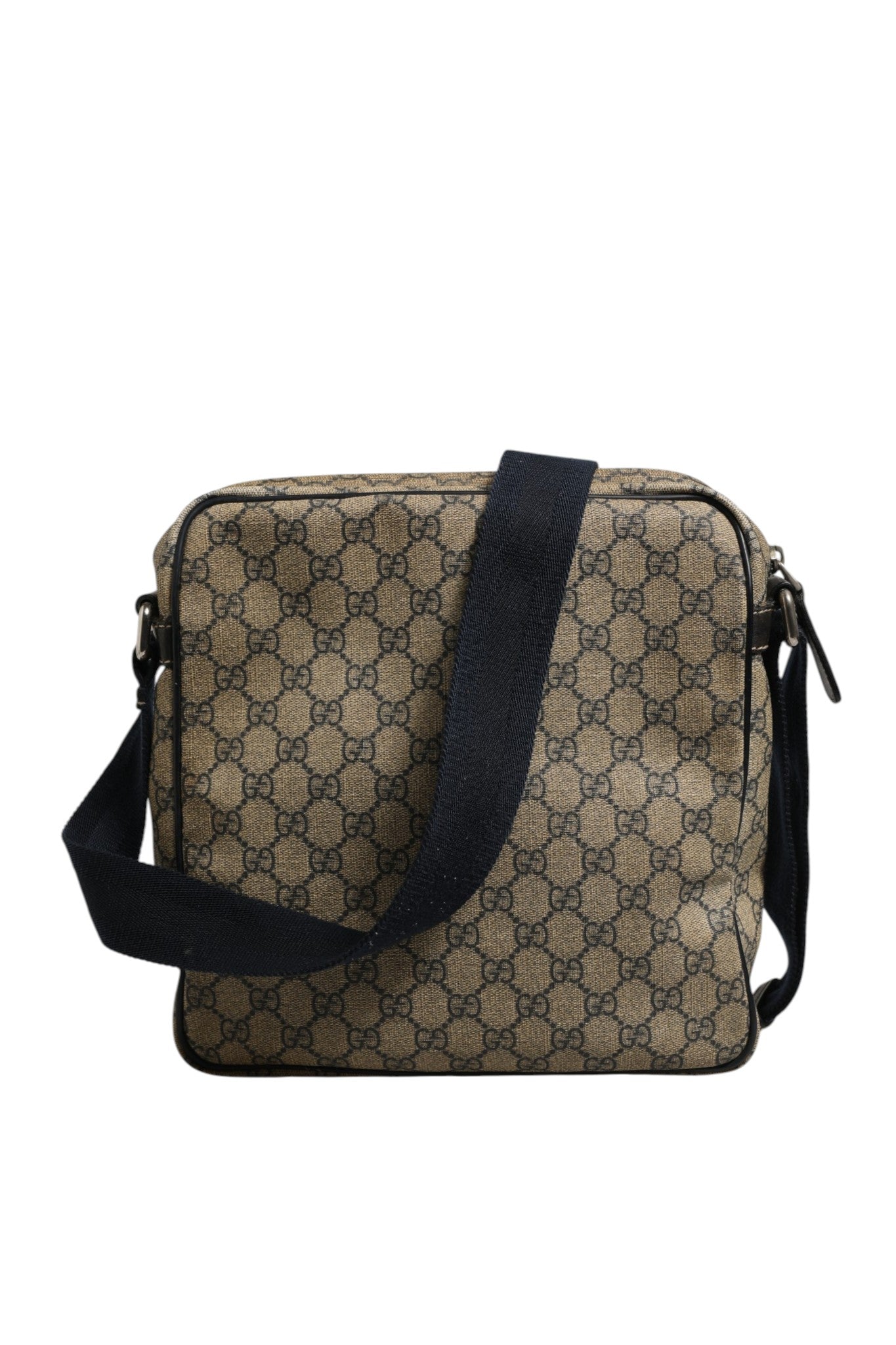 Sac messager Gucci Supreme en toile avec détails en cuir, logo Gucci visible, style élégant et pratique.