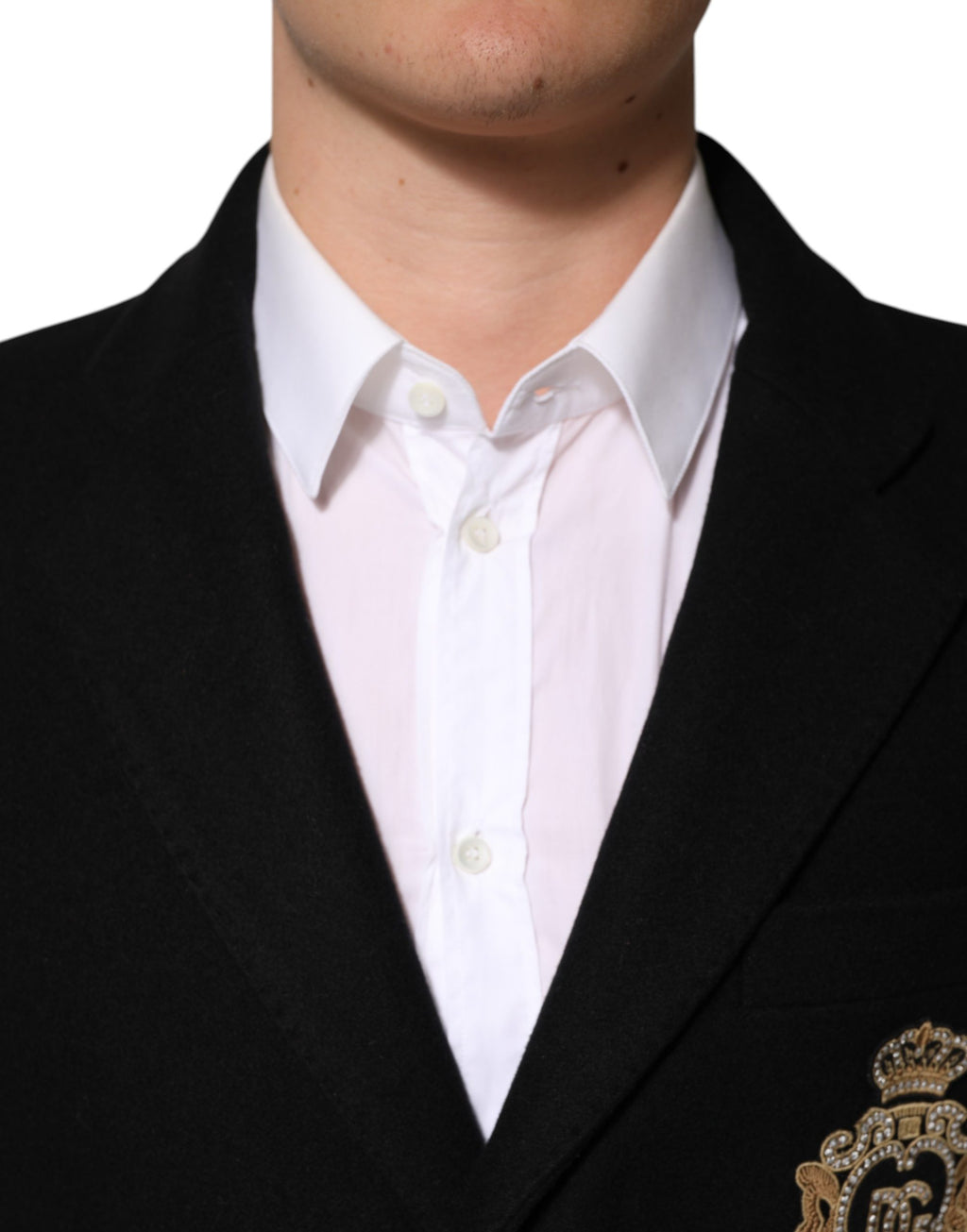 Veste noire Dolce & Gabbana à patch héraldique, cintrée, à un seul bouton, avec détails élégants visibles sur l'image