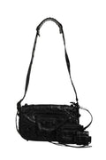 Sac à bandoulière Balenciaga Le Cagole XS avec fermeture à rabat, en cuir noir avec détails métalliques.