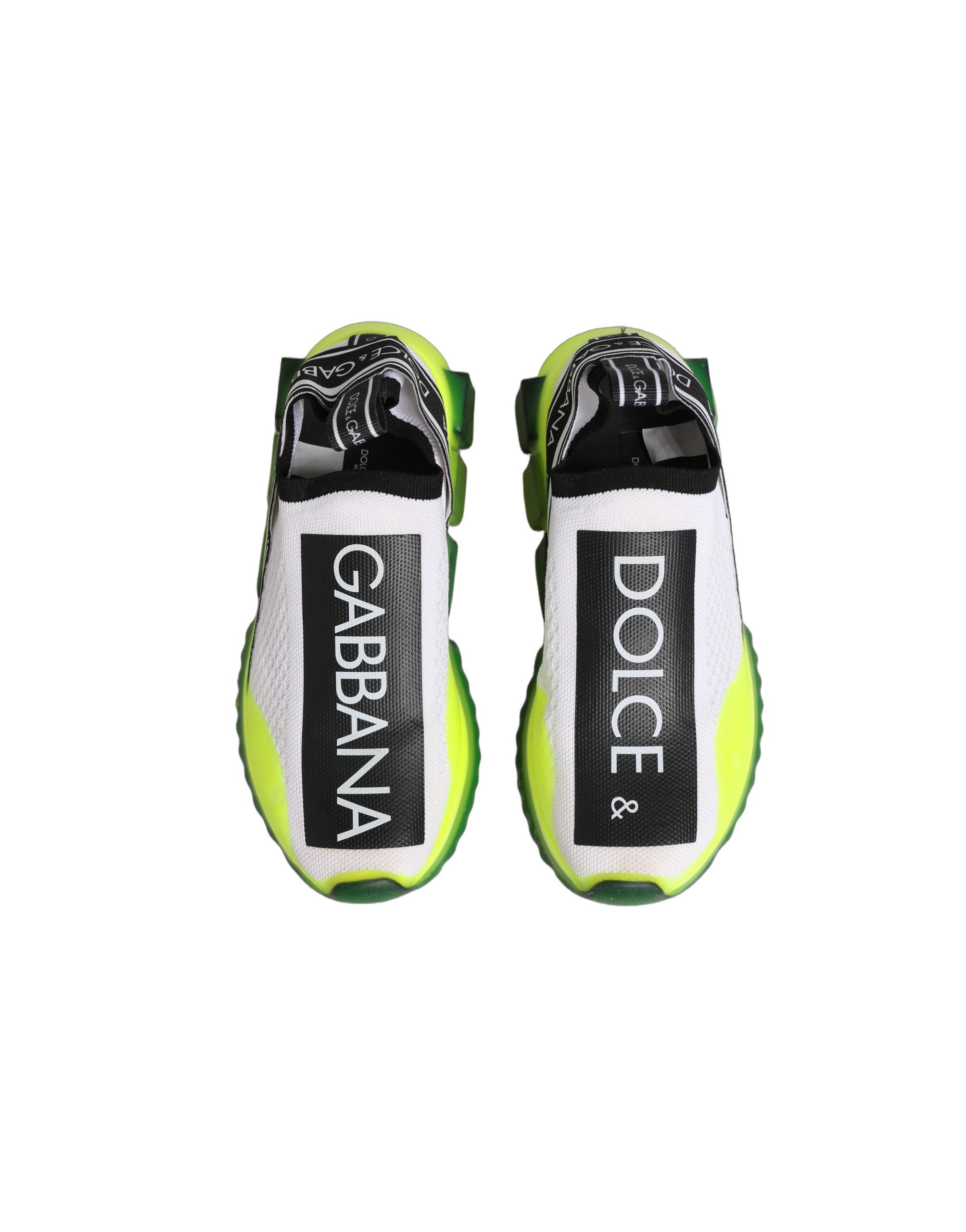 Chaussures slip-on Dolce & Gabbana Sorrento blanches et noires, baskets élégantes en cuir avec design moderne.