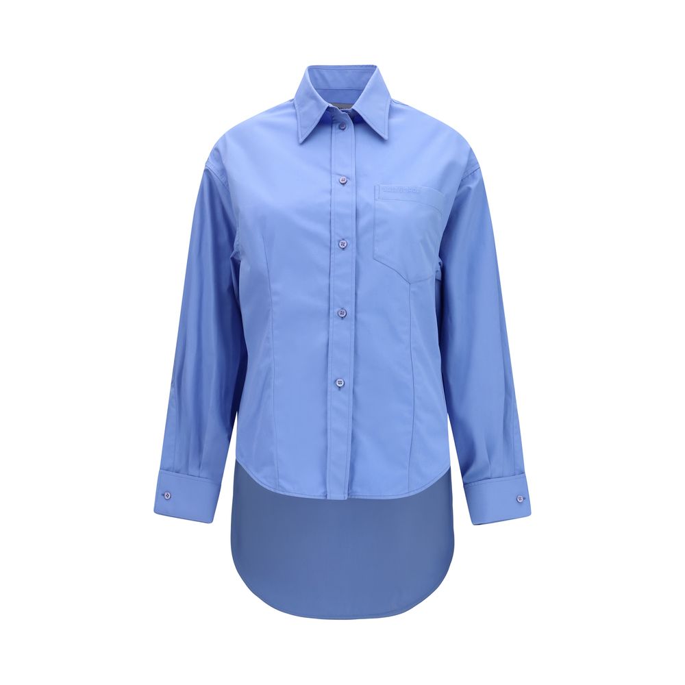 Chemise en coton bleue de la marque Balenciaga, coupe élégante et détails modernes visibles sur l'image.