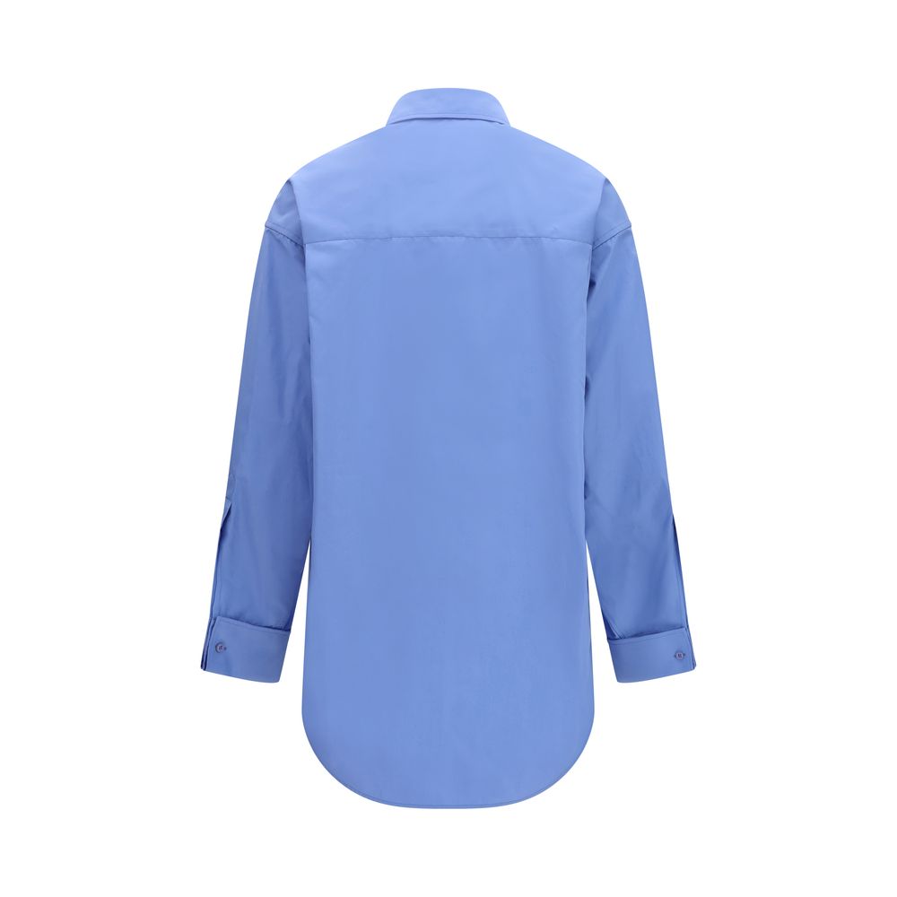 Chemise en coton bleue de la marque Balenciaga, coupe élégante avec col classique et boutons visibles.