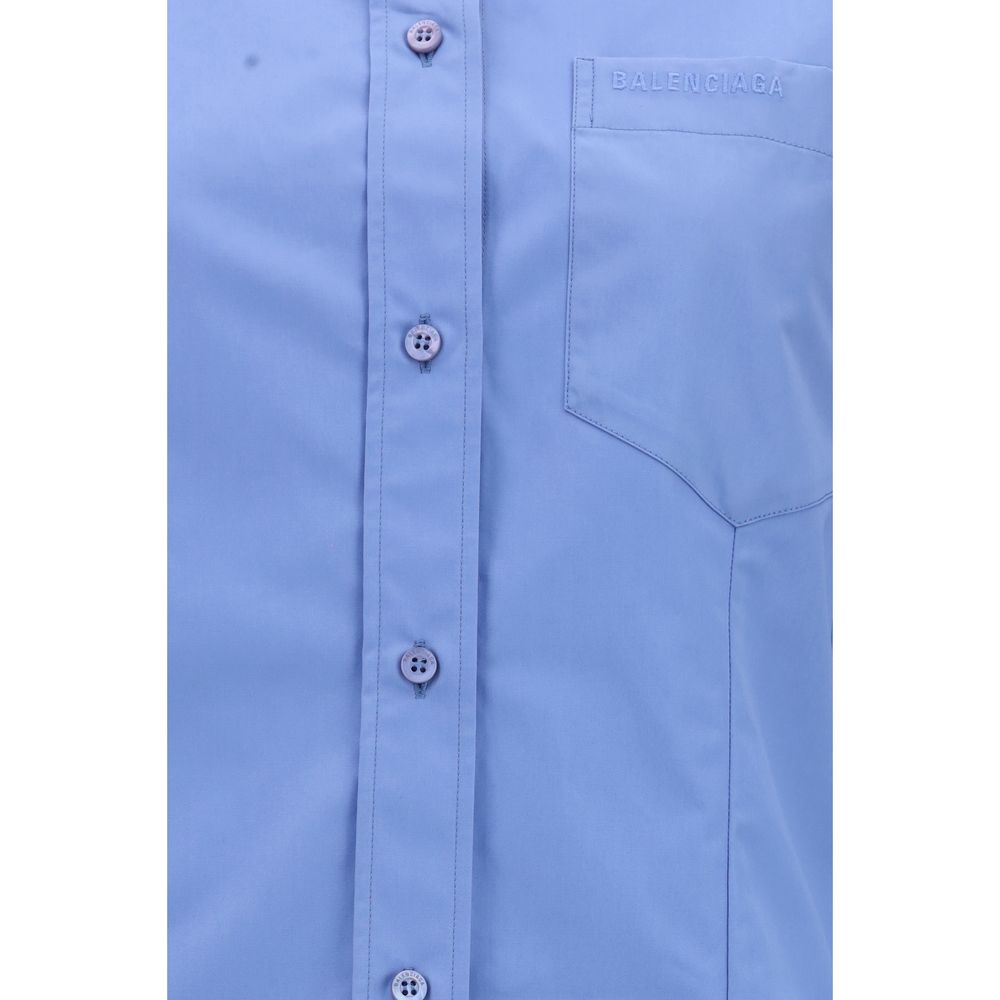 Chemise bleue en coton de Balenciaga, vue de face, avec col classique et boutons, pour un style élégant et décontracté.