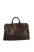 Sac Louis Vuitton Speedy Bandoulière 35 Damier Ebene avec poignée en cuir et bandoulière amovible, modèle emblématique en toile damier.