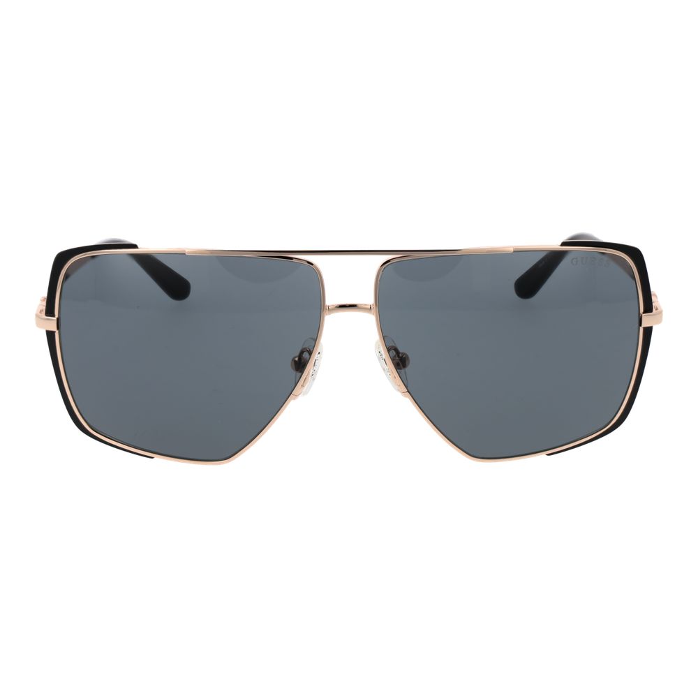 Lunettes de soleil en métal rose gold Guess, design élégant avec monture fine et verres teintés.