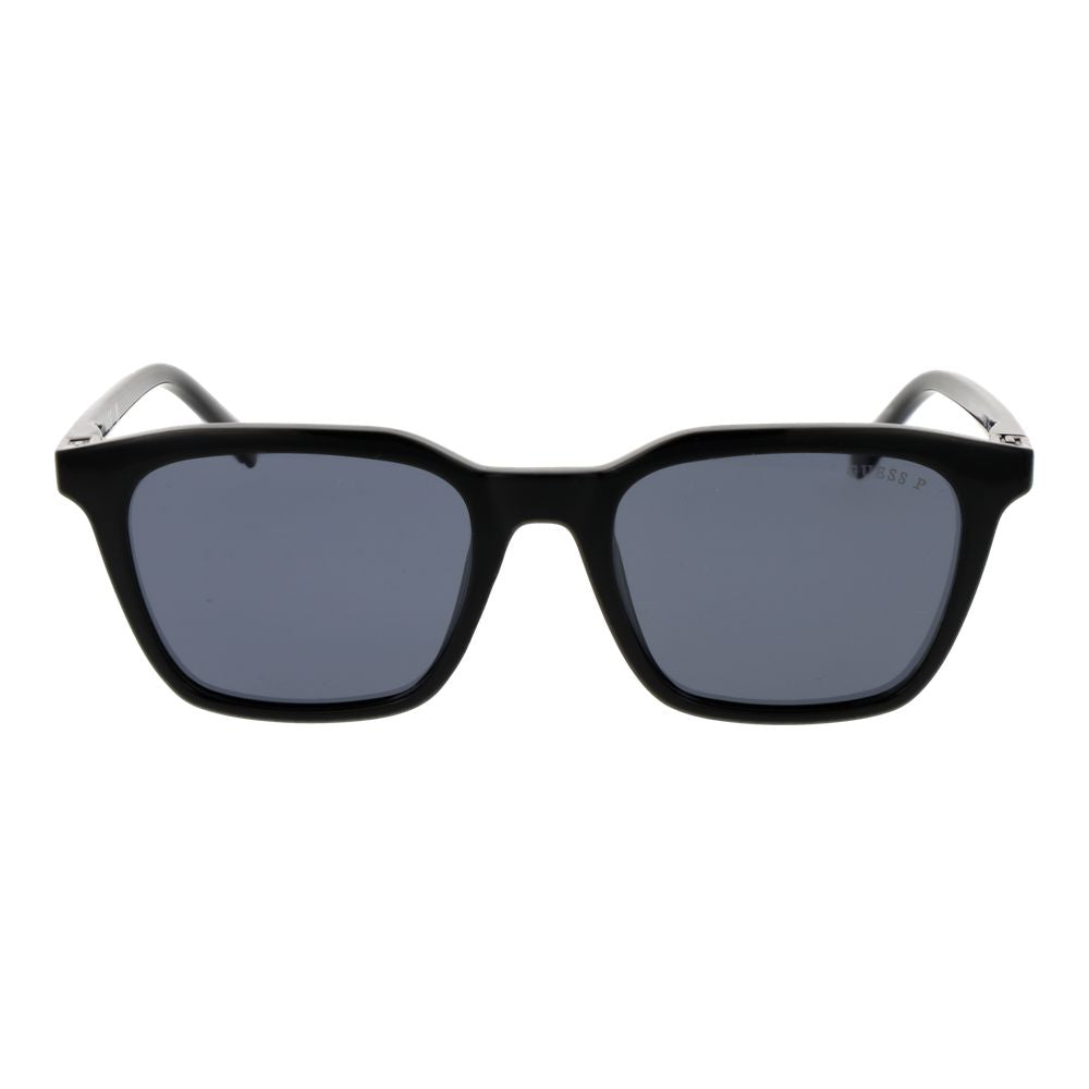 Lunettes de soleil Guess en plastique noir avec monture élégante et lentilles foncées, style moderne et tendance.