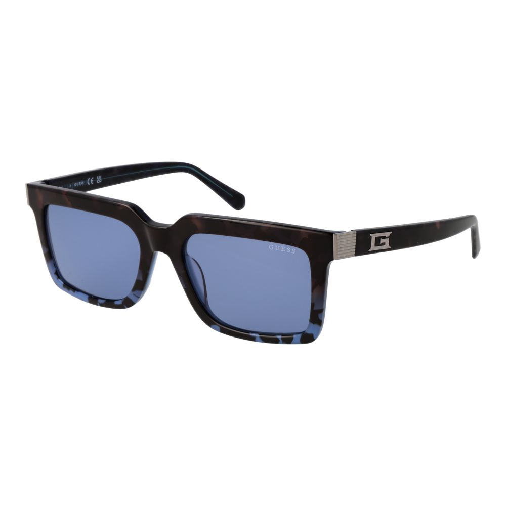 Lunettes de soleil Guess en acétate marron avec monture élégante et branches épaisses, pour un style tendance et moderne.