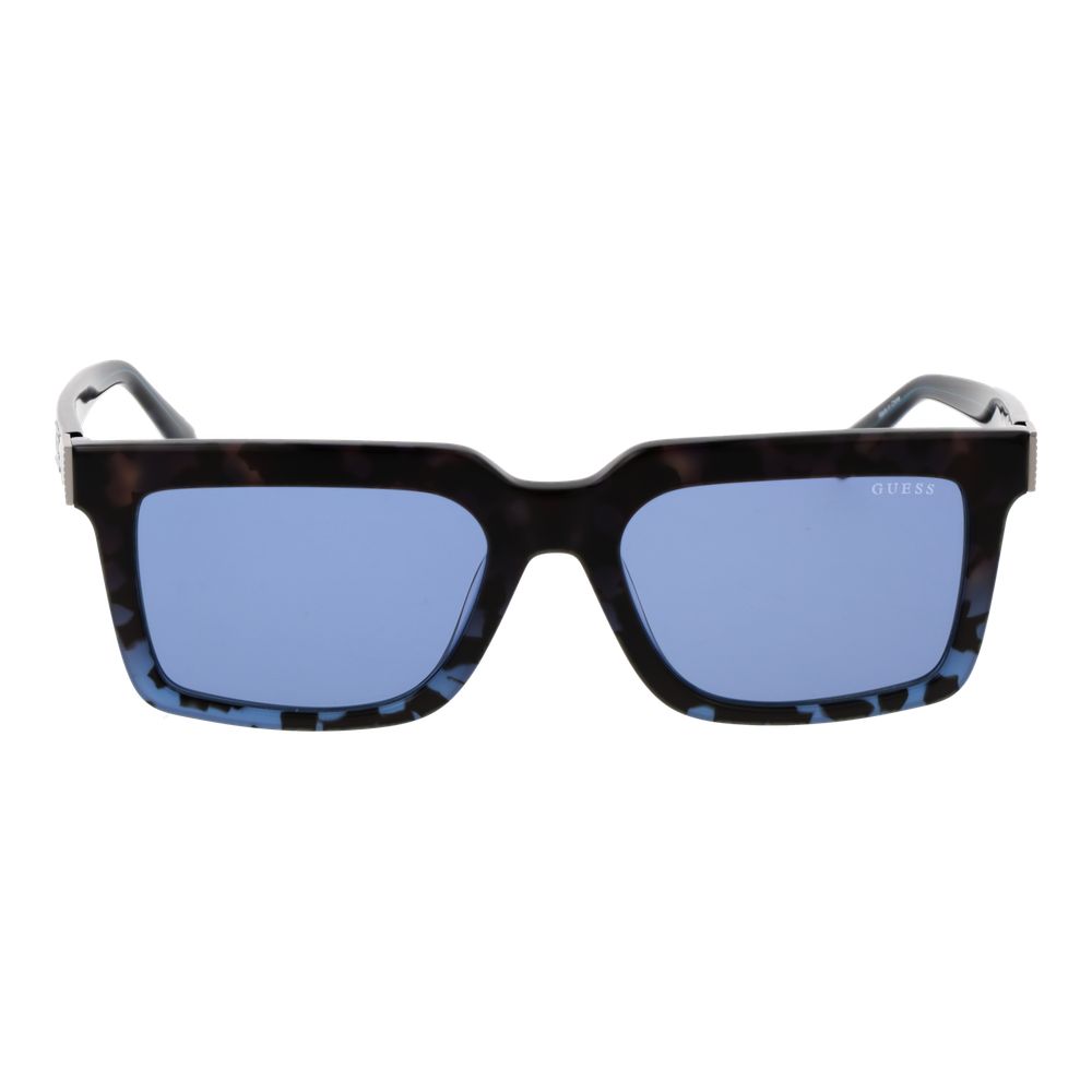 Lunettes de soleil Guess en acétate brun avec monture ronde et verres teintés, mode élégante et protection solaire.