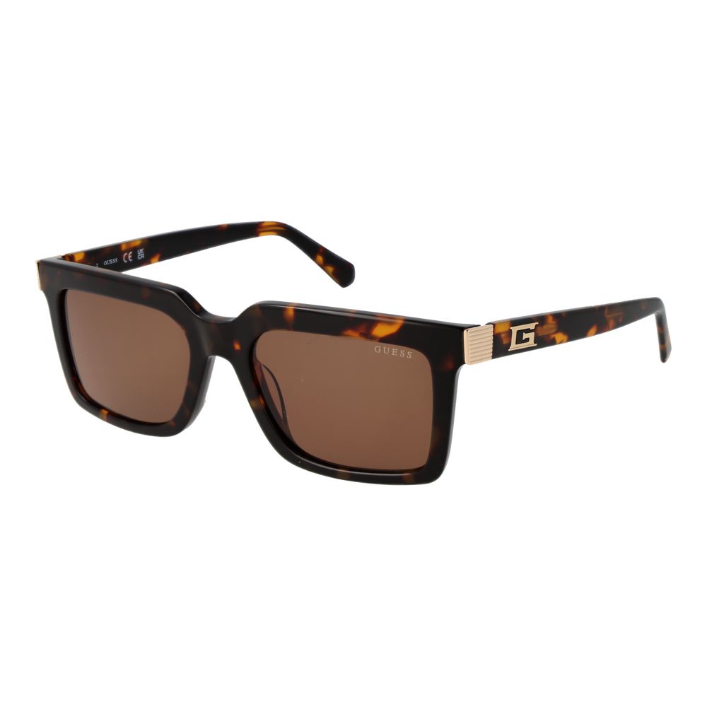 Lunettes de soleil Guess marron en acétate, style élégant avec monture ronde et branches épaisses, pour un look tendance.