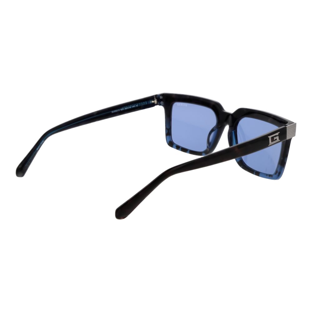 Lunettes de soleil Guess en acétate marron avec monture ronde et lentilles foncées, mode élégante et tendance.