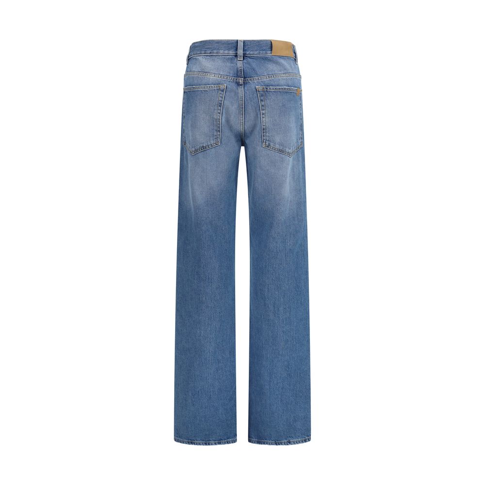 Jeans droits en coton bleu de la marque Calvin Klein, vue de face avec fermeture éclair et poches avant.