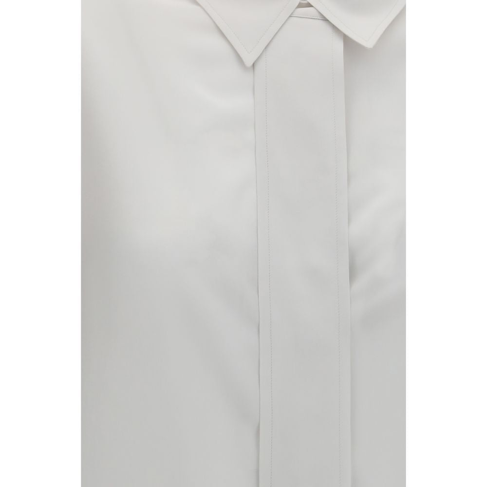 Chemise en soie blanche pour femme de la marque Calvin Klein, détail élégant et tissu fluide visible sur l'image.