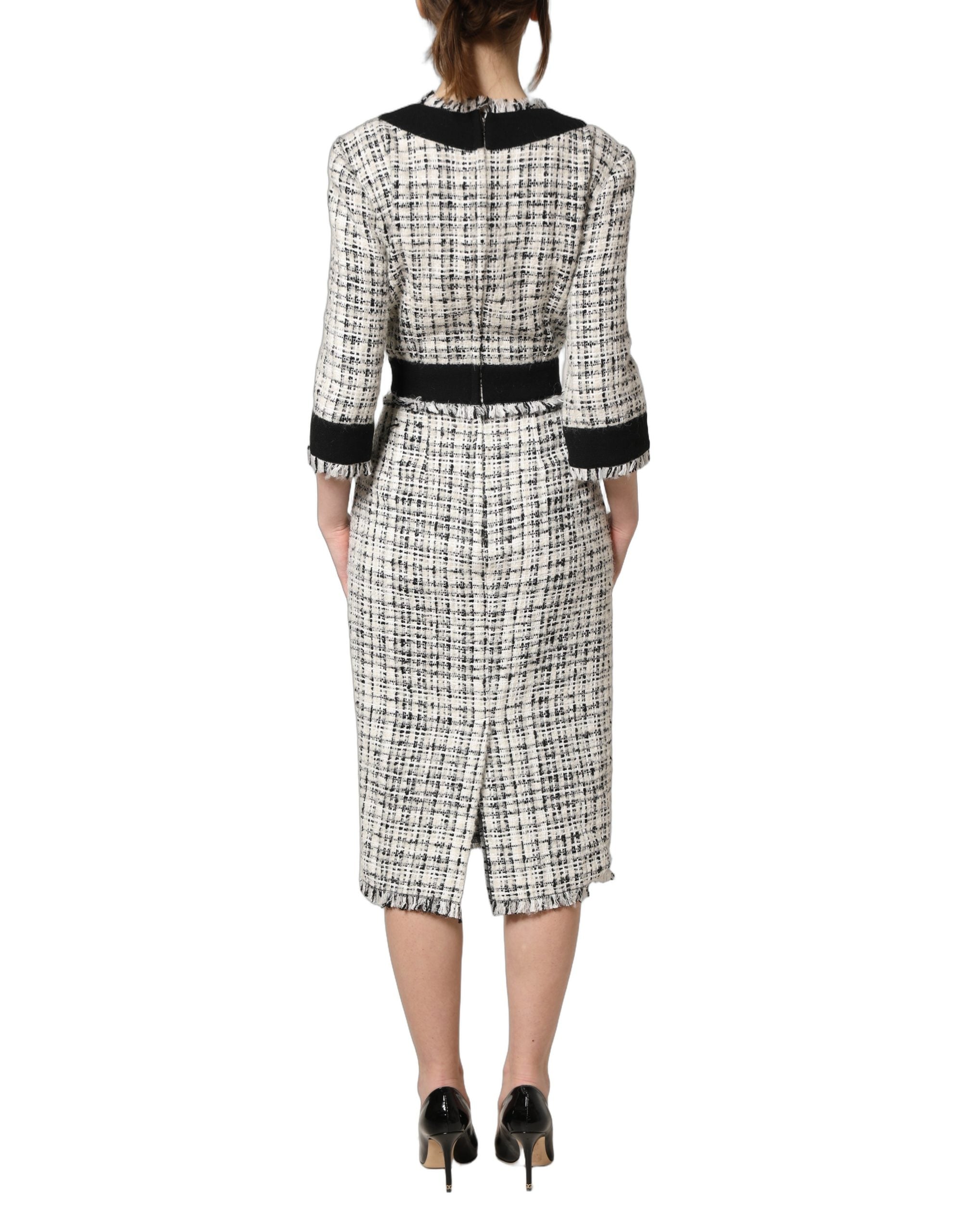 Robe midi Dolce & Gabbana en tweed noir et blanc, coupe cintrée et ligne A, élégante et sophistiquée.