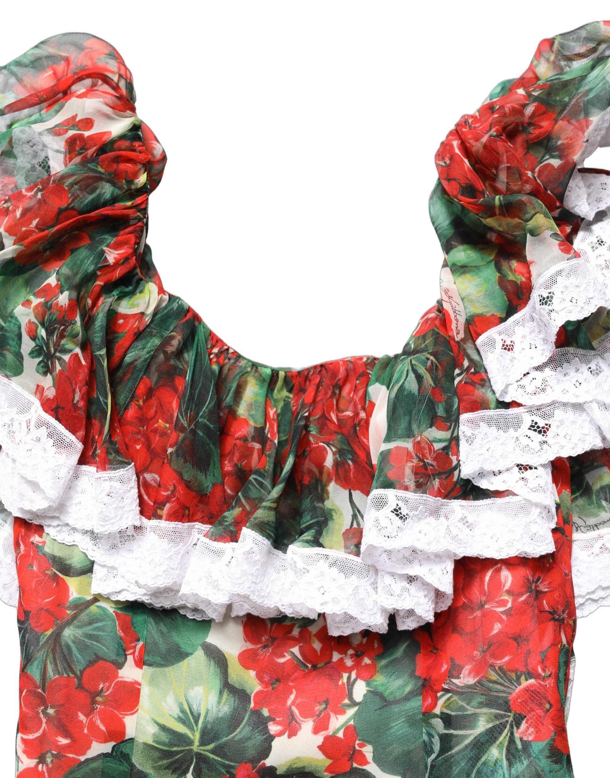 Robe longue à fleurs multicolores en dentelle Dolce & Gabbana, style maxi avec motif de geraniums, élégante et sophistiquée.