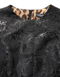 Robe longue noire florale en jacquard à coupe évasée et ligne A, signée Dolce & Gabbana.