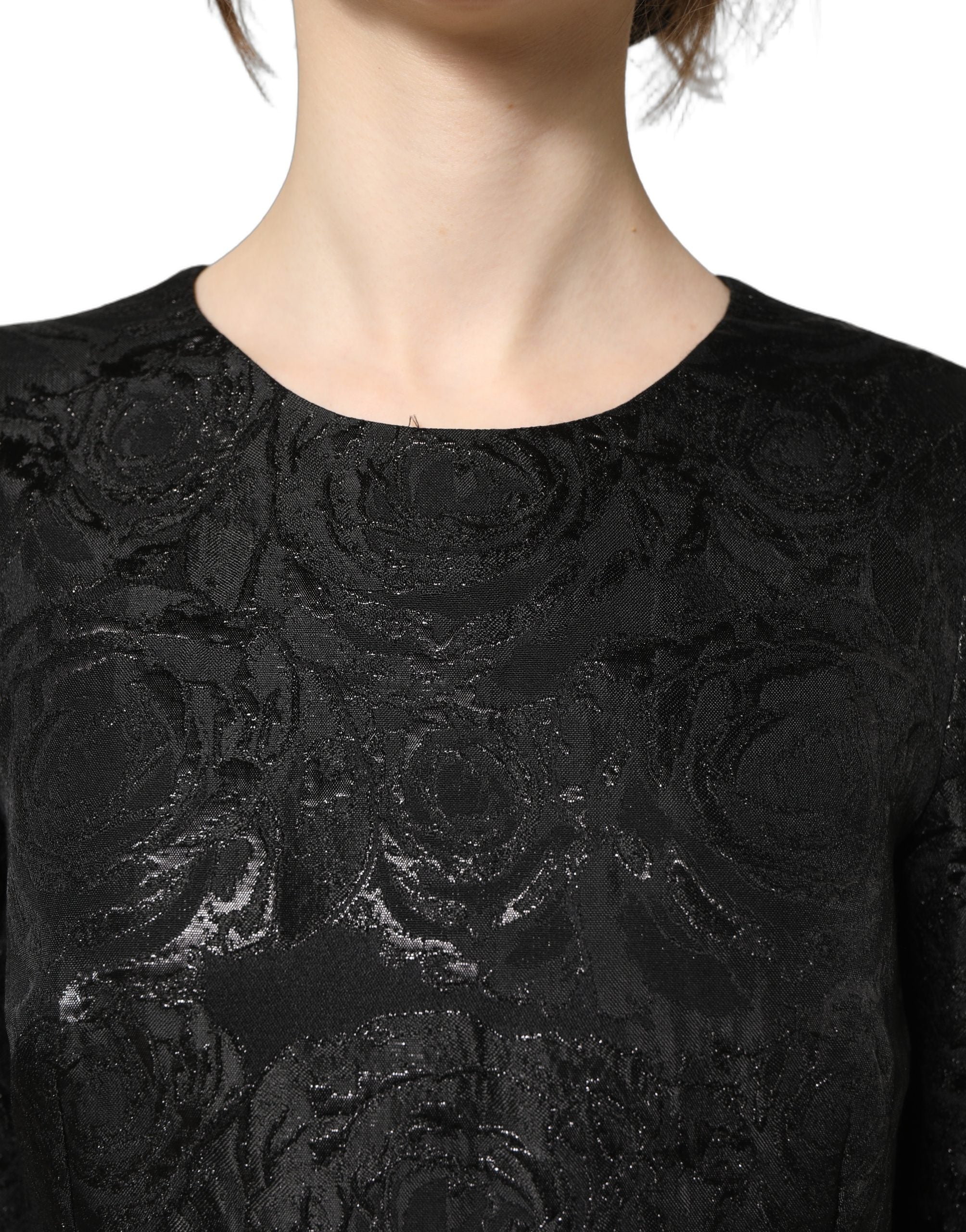 Robe évasée en jacquard floral noir de Dolce & Gabbana, style élégant avec coupe fluide et détails sophistiqués.