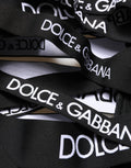 Pantalon skinny taille haute noir Dolce & Gabbana avec logo et découpes, style moderne et élégant.