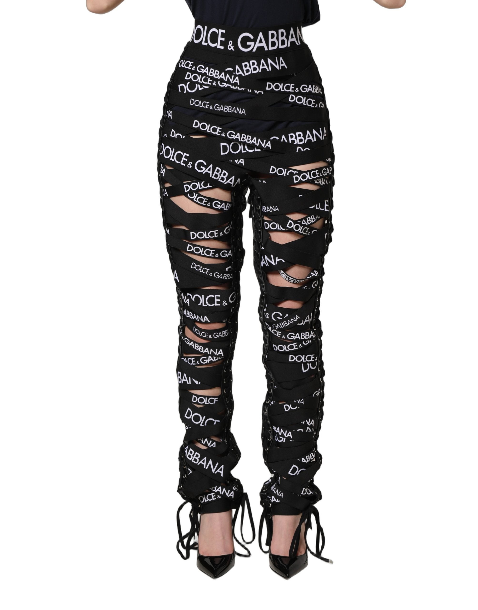 Pantalons skinny à taille haute noirs Dolce & Gabbana avec bande logo et découpes, style moderne et élégant.