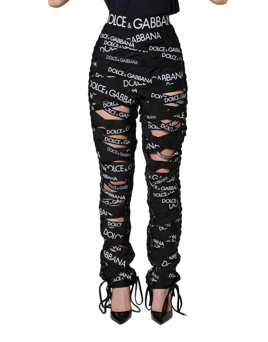Pantalons skinny à taille haute noir Dolce & Gabbana avec bande logo et découpes, en tissu élégant et moderne.