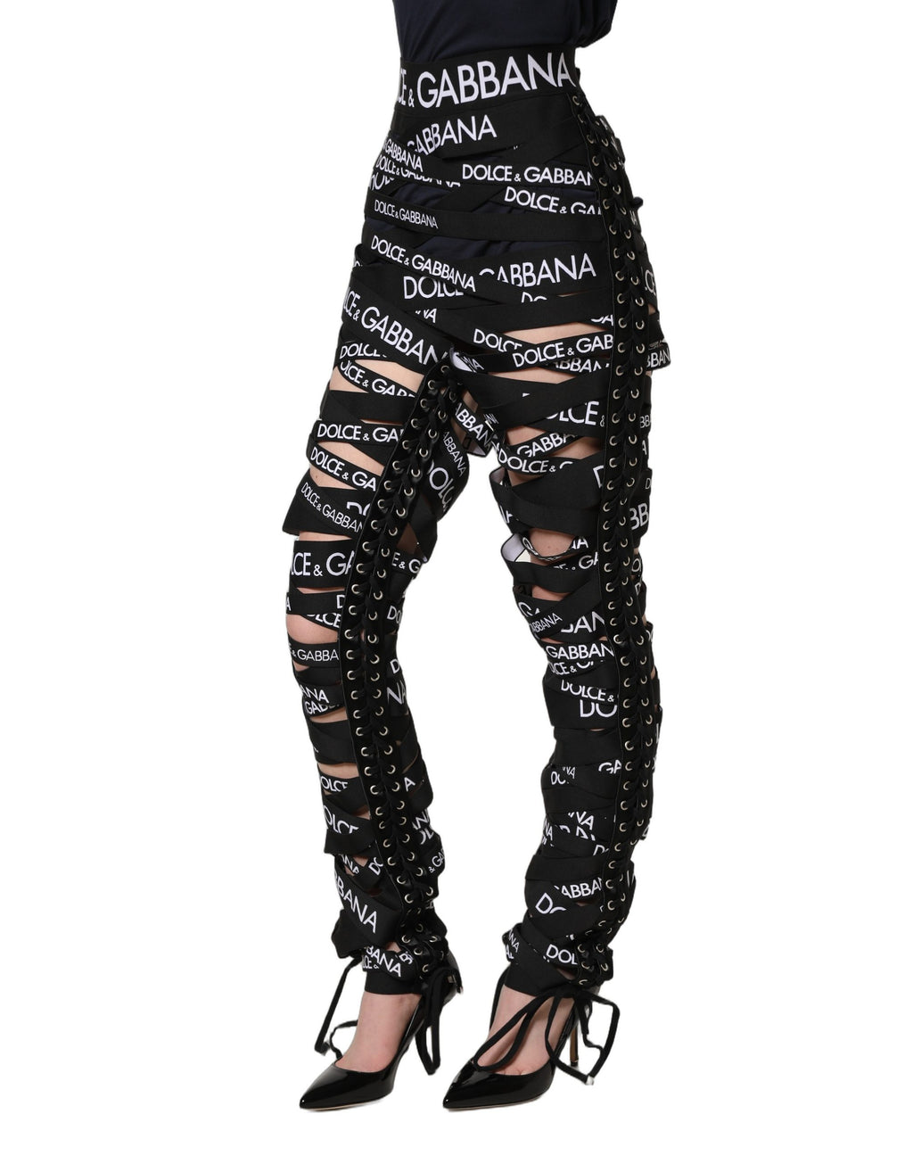 Pantalons skinny taille haute noirs Dolce & Gabbana avec bande logo et découpes élégantes, style moderne et tendance.