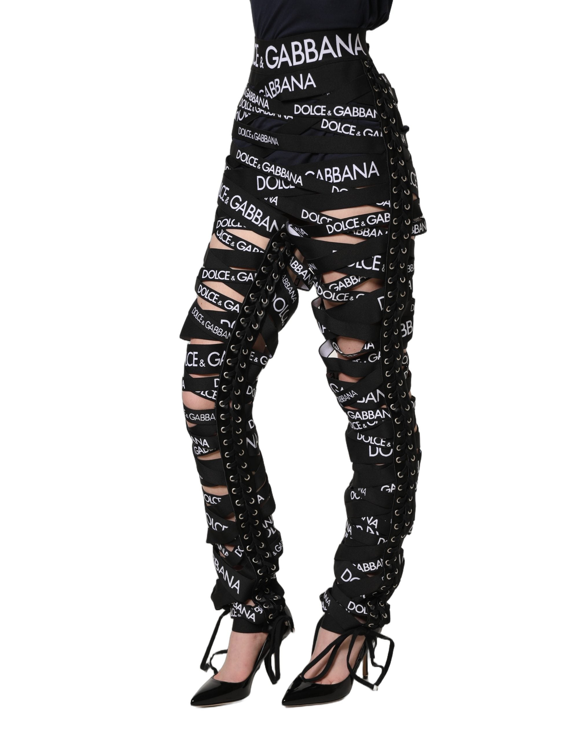 Pantalons skinny taille haute noirs Dolce & Gabbana avec bande logo et découpes élégantes, style moderne et tendance.