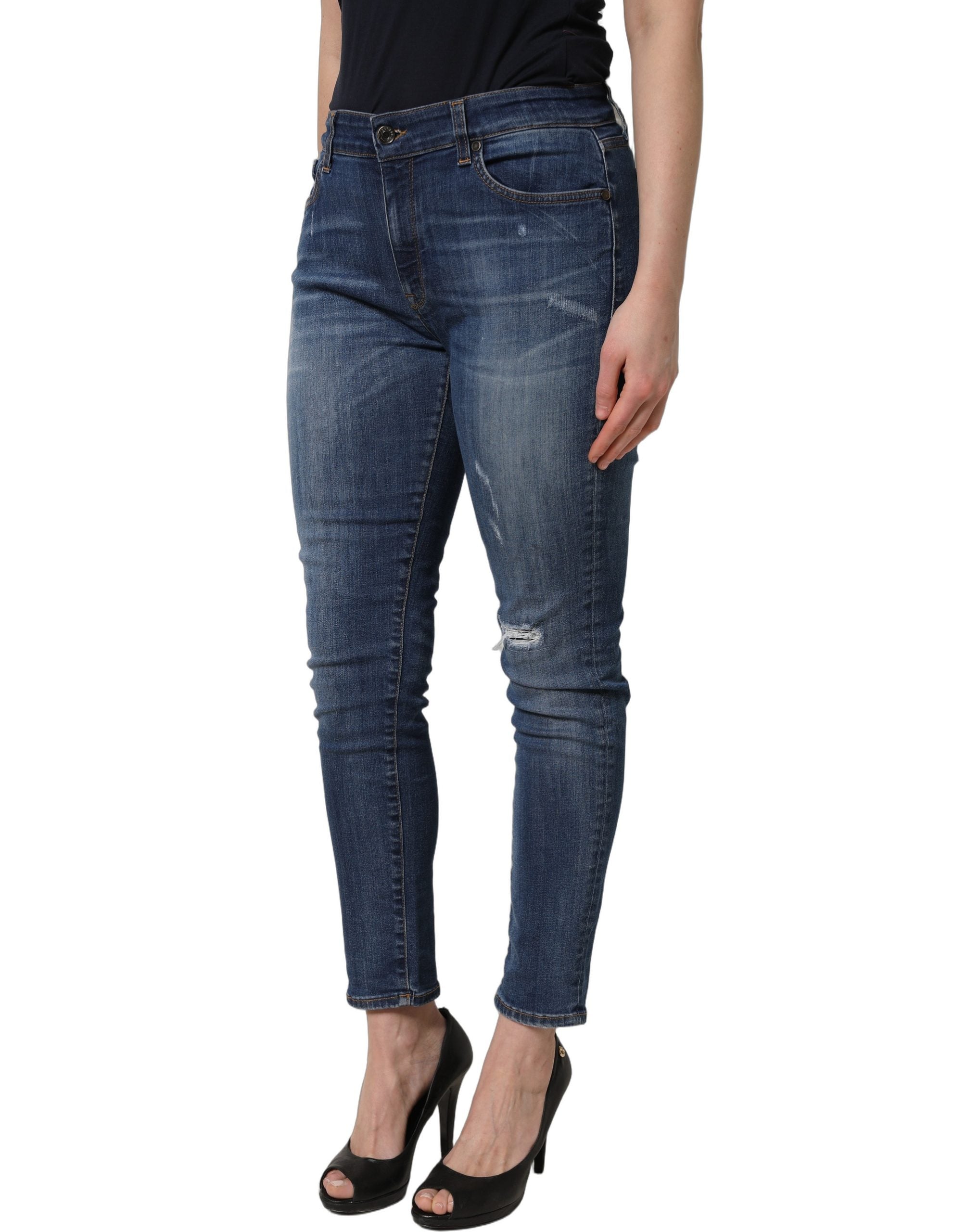 Jeans skinny déchirés Dolce & Gabbana en denim bleu à taille mi-haute avec un style décontracté et tendance.